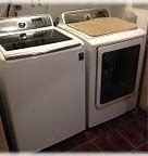 Image result for Bathroom with Stackable Washer Dryer