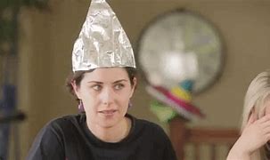 Image result for Woman Wearing Tin Foil Hat