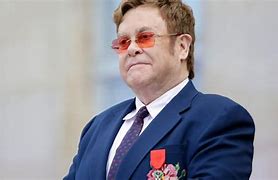 Image result for Elton John with Headphnes