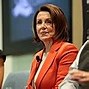 Image result for Pelosi Giggling Passing Out Gold Pens