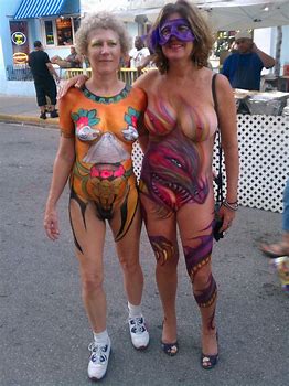 Fully nude milf in body paint showing her big boobs and po