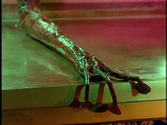 Image result for War of the worlds dying alien arm
