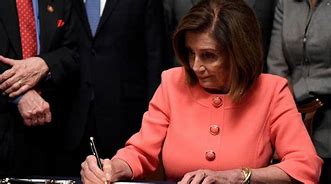 Image result for Pelosi Hands Out Pens with Her Name On Them