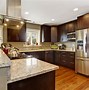 Image result for Medium Wood Kitchen Cabinets with Light Countertops