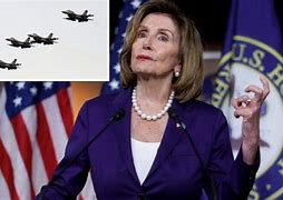 Image result for Nancy Pelosi On Plane with Trump Hat
