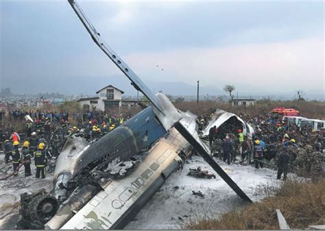 wreckage of a us bangla airlines passenger plane is pictured as rescue  