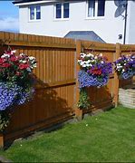 Image result for DIY Planters Against Wooden Fence
