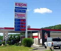 Image result for Exxon smashes earnings records