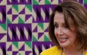 Image result for Nancy Pelosi in Kente Cloth Getting Help Up