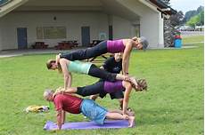 A little fun with a 4 person stacked plank pose after July Yoga in the
