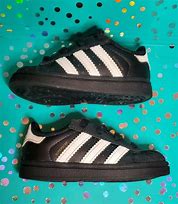 Image result for Black Adidas Shell Toe with Orange Accent