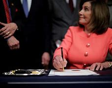 Image result for Pelosi Hands Articles of Impeachment Pen to Schiff