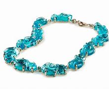 Image result for Nancy Pelosi Gold Jewelry