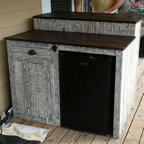 Custom outdoor bar with mini fridge, storage cabinet and drawer  
