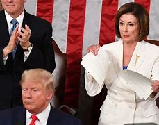 Image result for Nancy Pelosi with a Trump Hat