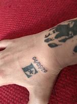 Image result for Elton John Tattoo
