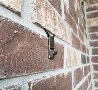Image result for Picture Hangers for Brick Walls
