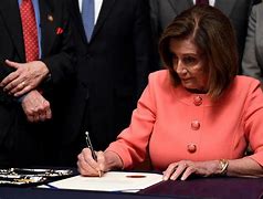 Image result for Nancy Pelosi Signs the Impeachment Documents