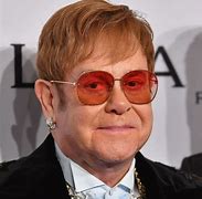 Image result for Elton John Hair Transplant or Wig