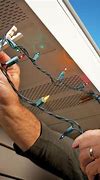 Image result for Hanging Christmas Lights On House