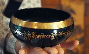 Image result for playing the tibetan singing bowl