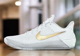 Image result for White and Gold Nike Basketball Shoes