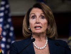 Image result for Nancy Pelosi Pres Conference with Sign