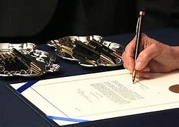 Image result for Pelosi Hands Out Pens Images