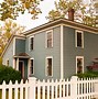 Image result for White Picket Fence Infront of Blue House