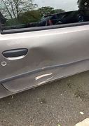 Image result for Car Door Dent by a Shopping Cart Photo