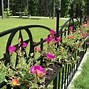 Image result for Hanging Baskets On Privacy Fence