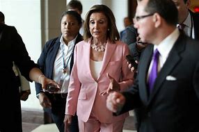 Image result for Pelosi Standing by Display of Criteria for Impeachment