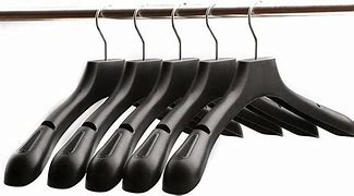 Image result for Brown Plastic Coat Hangers