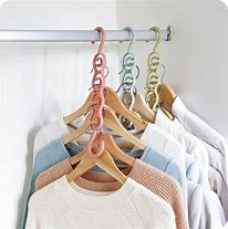 Image result for Plastic Clothes Hanger Holder