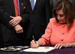Image result for Nancy Pelosi Signing Pens Celebration