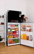 Image result for GE Profile. Top Freezer Refrigerator