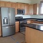 Image result for GE Slate Appliances with Oak Cabinets