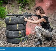 Image result for Woman Shooting Machine Gun
