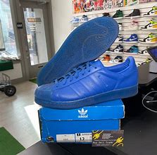 Image result for Adidas Shell Toe Blue Orange Green