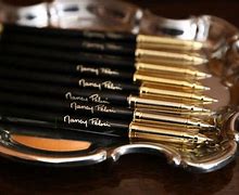 Image result for Nancy Signs Impeachment with Pens