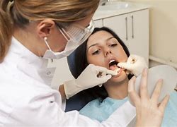 Image result for Dentist Cleaning Teeth