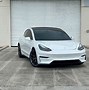 Image result for Tesla Towing a Generator