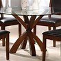 Image result for Round Wood Dining Table with Metal Base