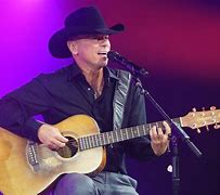Image result for Picture of Kenny Chesney Play On Piano