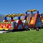 Image result for Obstacle Course Bounce House Green and Yellow