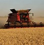 Image result for Tractor and Combine Harvester