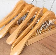 Image result for wooden clothes hangers wall