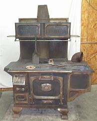 Image result for Antique Cast Iron Wood Cook Stove