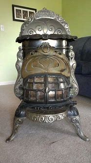 Image result for Antique Radiant Cast Iron Gas Parlor Stove