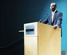 Image result for Speaking at a Podium Stock Image